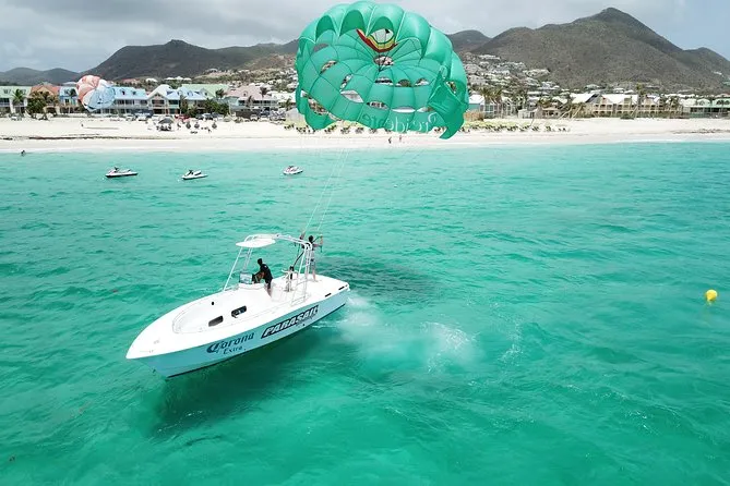 Tandem parasail flight high above turquoise water during parasailing in St Maarten over Orient Bay Beach